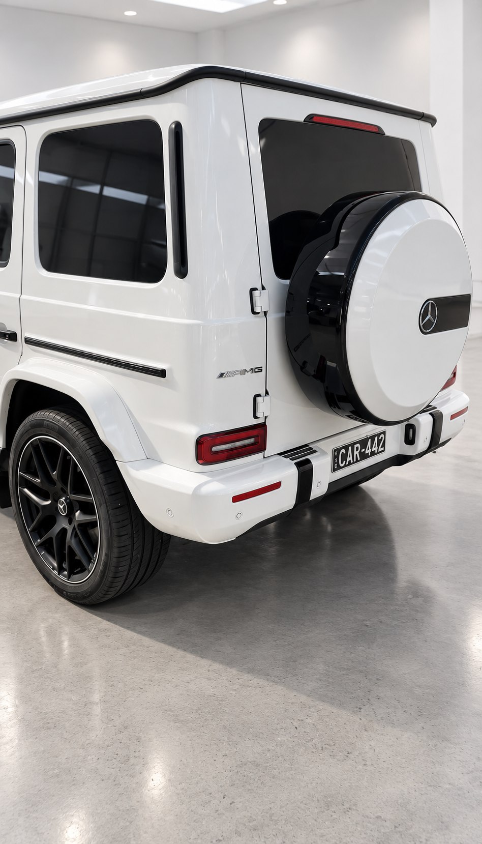 White Mercedes-Benz G-Class in a showroom